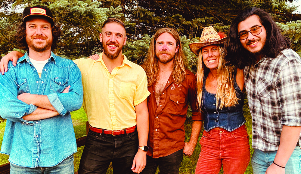 Members of Santa Cruz country and Americana band Kentucky Mule posing outdoors.