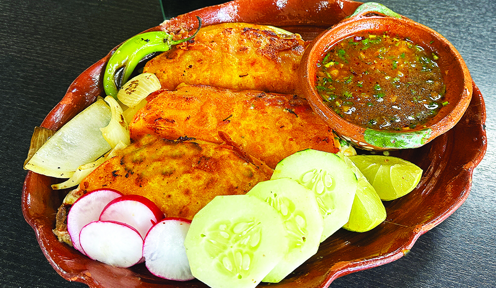 Queso barrio combination plate served at Taqueria Los Viejones in Santa Cruz.