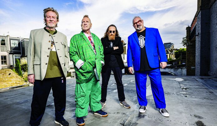 Rejecting Nostalgia Public Image Ltd band members pose outdoors