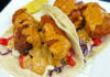 Fareway Food Battered fish tacos topped with shredded cabbage, diced vegetables and creamy orange sauce at The Clubhouse.