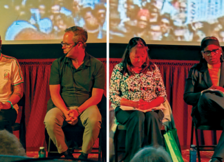 Vote Hope Four panelists sit onstage with notes during the Romero Institute’s voting rights town hall at the 418 Project.