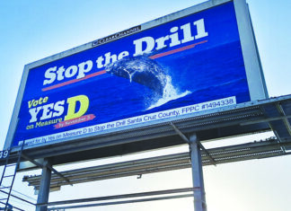Fortifying the Blue Wall Blue billboard featuring a breaching whale reads “Stop the Drill” and urges a yes vote on Measure D by November 3.