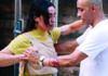 The Last Dance? Two dancers hold hands in a close partner-dance position, one wearing a yellow shirt and the other a white shirt.